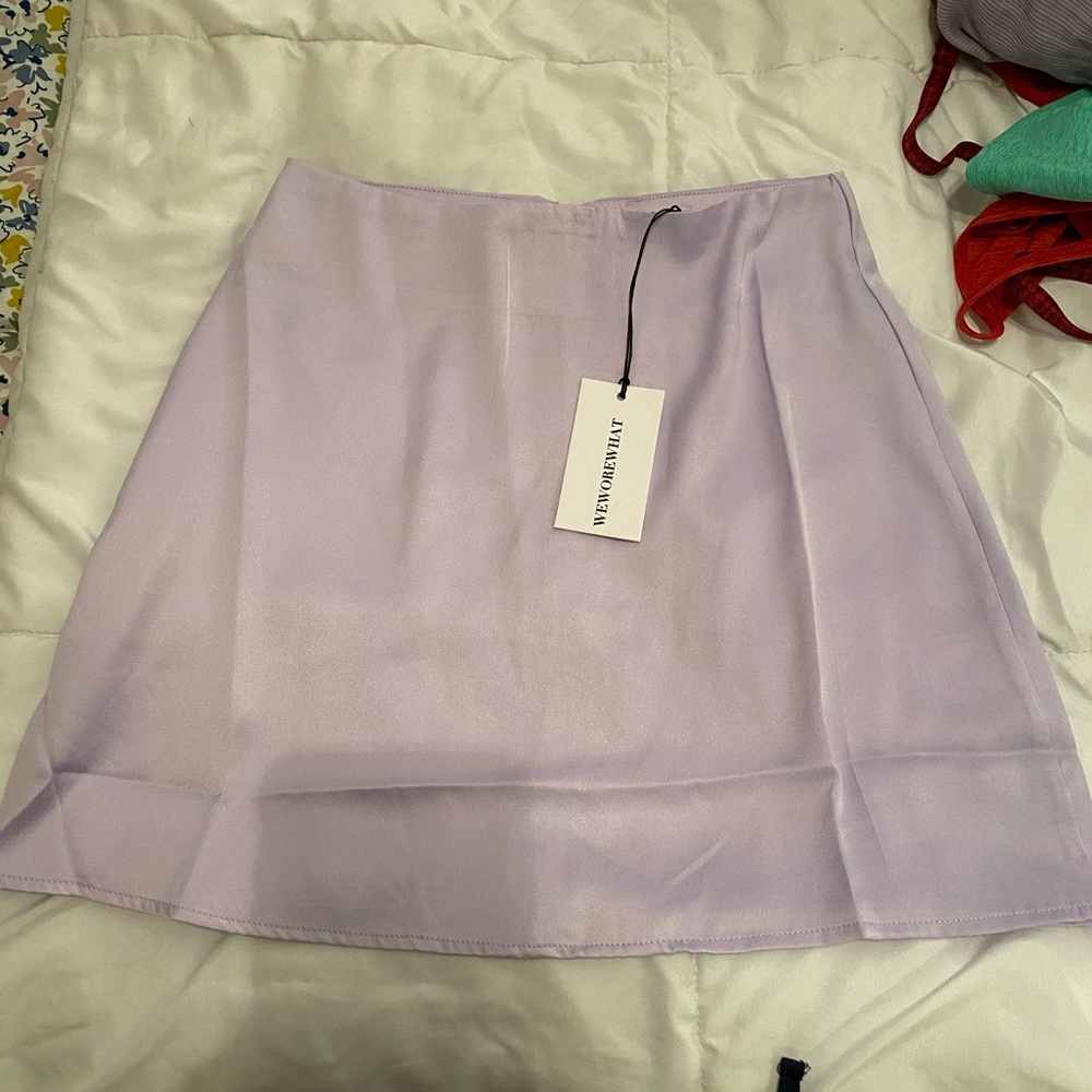 New with tags satin heather purple skirt. We wore what
